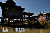 Inle Lake Myanmar. All the buildings are constructed on piles. Residents travel around by canoe, but there are also bamboo walkways and bridges over the canals, monasteries and stupas. 